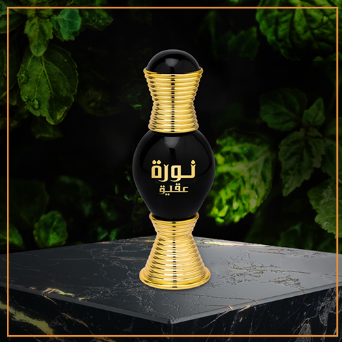 A black bottle with gold accents on top of a table.