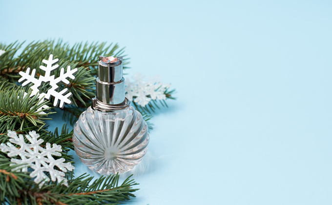 A bottle of perfume sitting on top of a table.